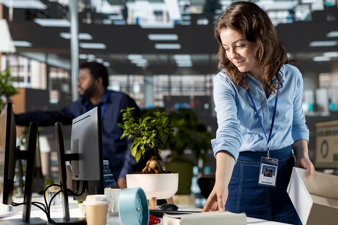 A new office employee setting up her work station.